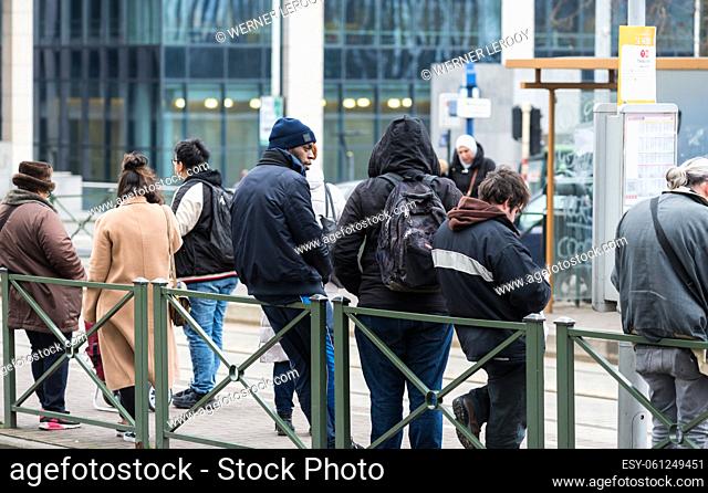 Brussels Business district, Brussels Capital Region - Belgium Group of mixed race waiting for the tram at the public transportation hub of Botanique, Rue Royale