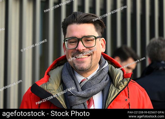 08 December 2022, Bavaria, Munich: Lawyer Marc Liebscher, who represents injured parties, smiles before the start of the trial against the former Wirecard CEO...