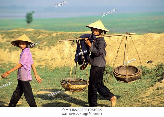 farmers carries a load Hue  Vietnam