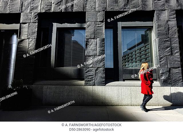 STOCKHOLM, Sweden Woman in red at the Riksbank, or Central Bank, a distinctive building in central Stockholm
