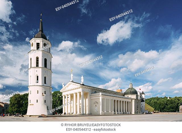 Vilnius, Lithuania. Cathedral Basilica Of St. Stanislaus And St. Vladislav With The Bell Tower In Summer Sunny Day, Blue Cloudy Sky Background