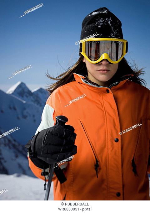 Close-up of an adult woman wearing ski goggles