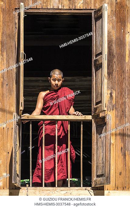 Myanmar (Burma), Shan state, Hsipaw, Maha Nanda Kantha monastery (or Bamboo Buddha monastery), young monk looking out the window