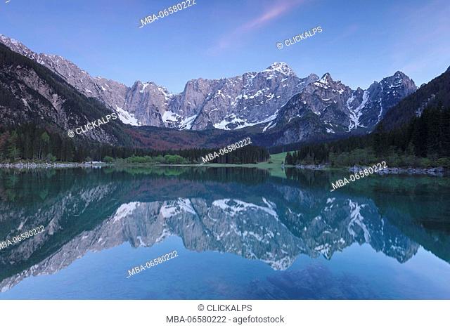 Europe, Italy, Friuli Venezia Giulia, Dusk at the Fusine upper lake with the Mangart mount on background