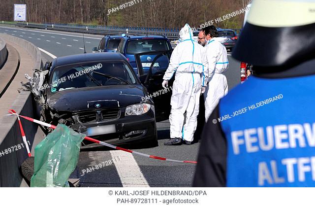 Police investigators secure traces on car on the Haseltalbruecke bridge of the A3 highway at Bischbrunn, Germany, 09 April 2017