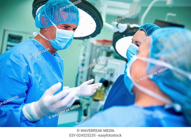 Surgeons interacting with each other in operation room