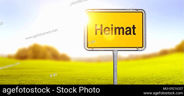 Shield 'Heimat' in front of landscape in backlight [M]