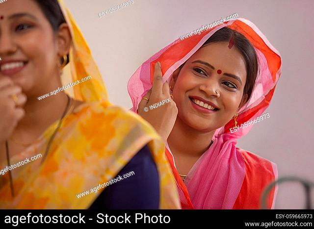 Two rural women smiling