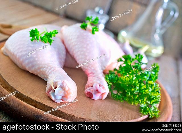 chicken legs on board and on a table