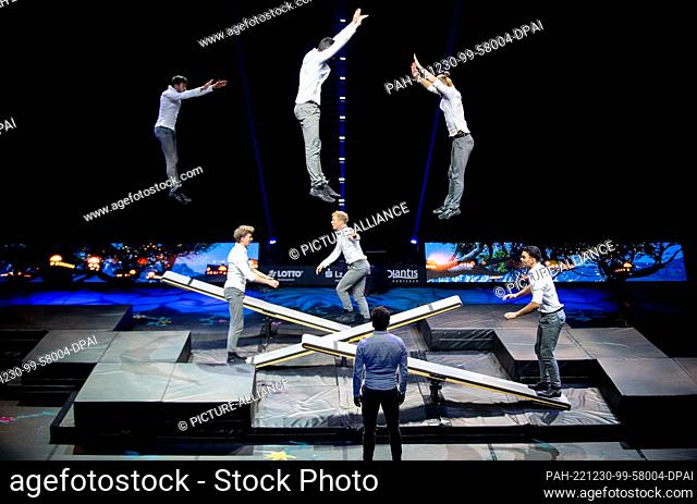 30 December 2022, Lower Saxony, Oldenburg: The show team ""Scandinavian Boards"" presents a performance on three skid boards during the show ""Spirit"" of the...