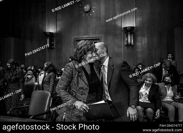Julianna Michelle Childs, left, gets a kiss from her husband Dr. Floyd Angus, following a Senate Committee on the Judiciary hearing for her nomination to be...