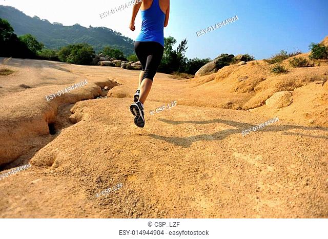 oung woman runner legs running