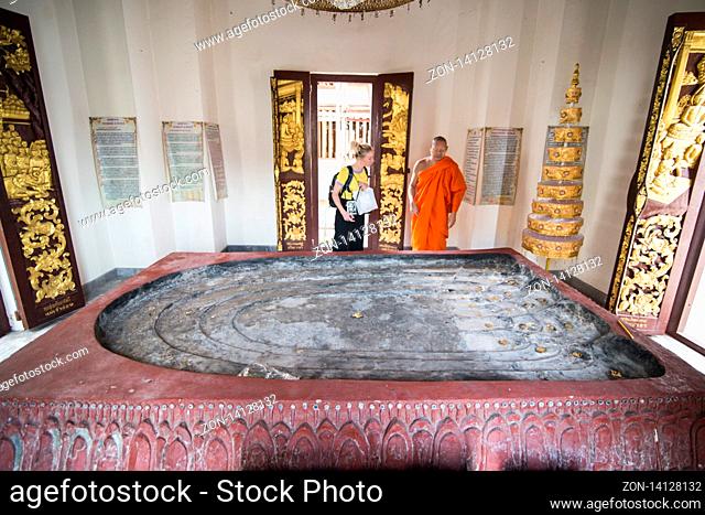 a Budda foot print at the Wat Phra Bat Ming Meuang Worawiharn in the old Town the city centre of Phrae in the north of Thailand