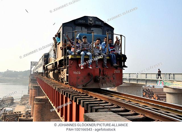 Old and new railway bridge with train in Ghorashal near Narsingdi on 09.01.2015 - Bangladesh | usage worldwide. - Ghorashal/Dhaka/Bangladesh
