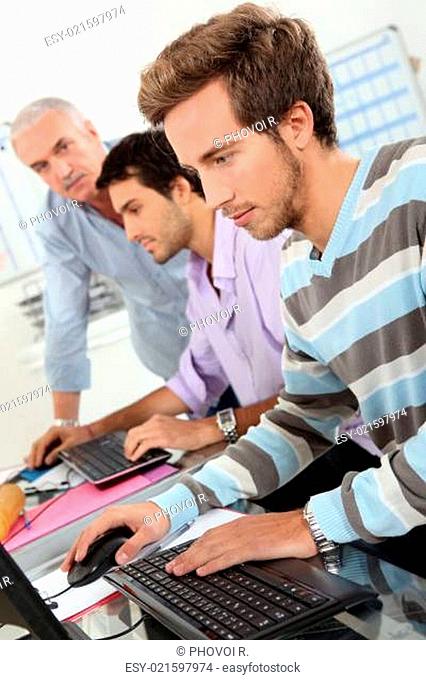 Young men using computers