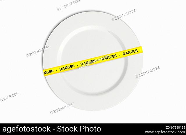 Yellow caution tape strips with text of danger on a white flat plate, isolated on white background