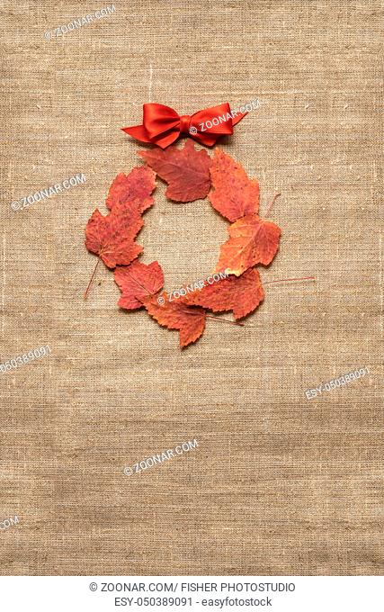 Creative thanksgiving day concept photo of leaves on brown background