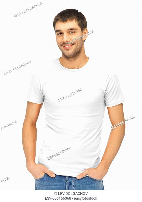 clothing design and hapy people concept - handsome man in blank white shirt