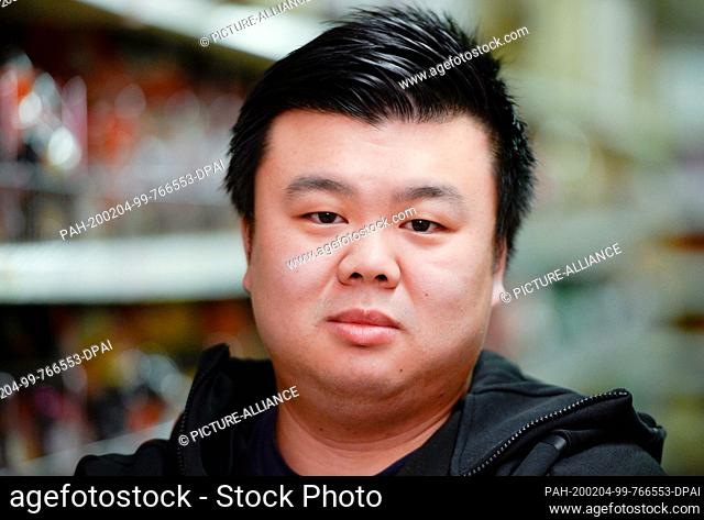 03 February 2020, North Rhine-Westphalia, Cologne: Yen Souw Tain, manager of a supermarket for Asian specialities in Cologne, is standing in his shop