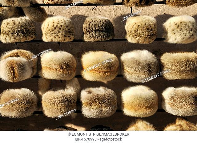 Fur hat for sale, historic adobe town of Khiva, Ichan Kala, Chiva, Unesco World Heritage Site, Uzbekistan, Central Asia