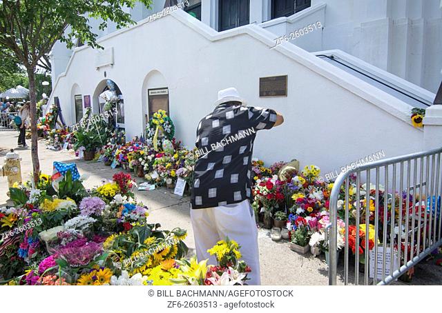 Famous Emanuel A. M. E. Church in Charleston South Carolina black church people leaving flowers and messages and taking pictures of the scene of horrible murder...