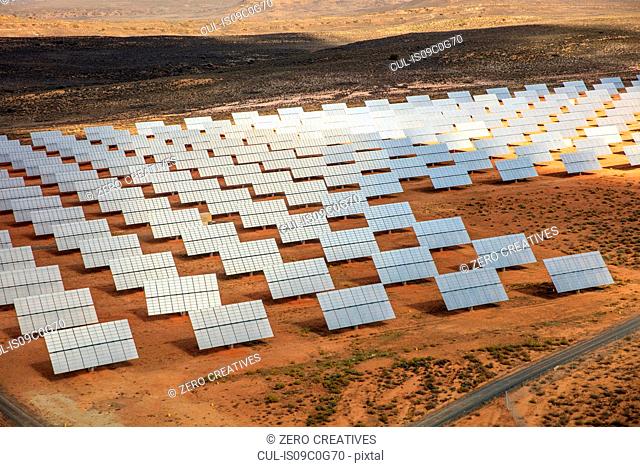 Rows of solar panels in arid landscape, aerial view, Cape Town, Western Cape, South Africa