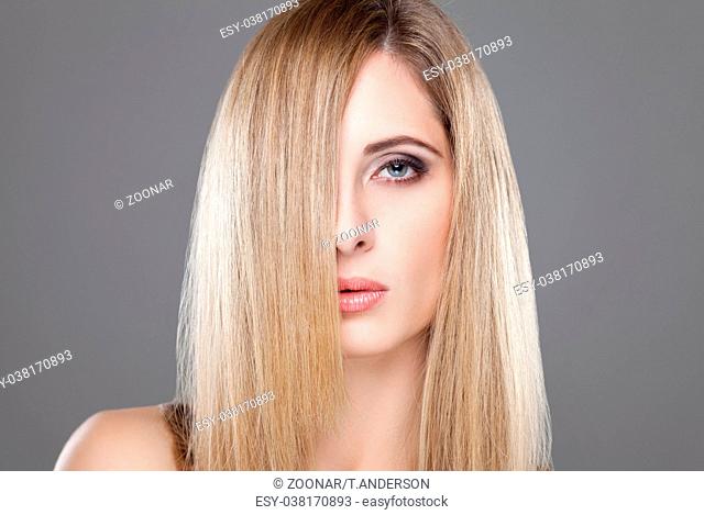 Portrait of an young blonde beauty with straight hair
