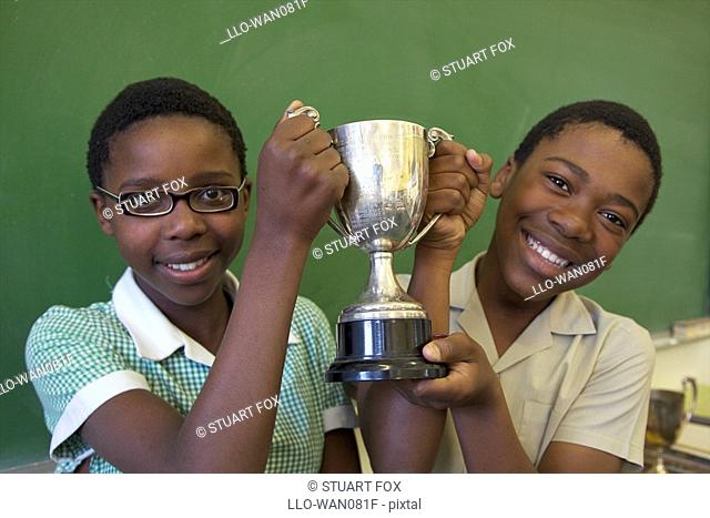 Portrait of two learners with their trophy, KwaZulu Natal Province, South Africa