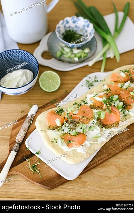 Spring-like pizza with salmon, cress and wasabi