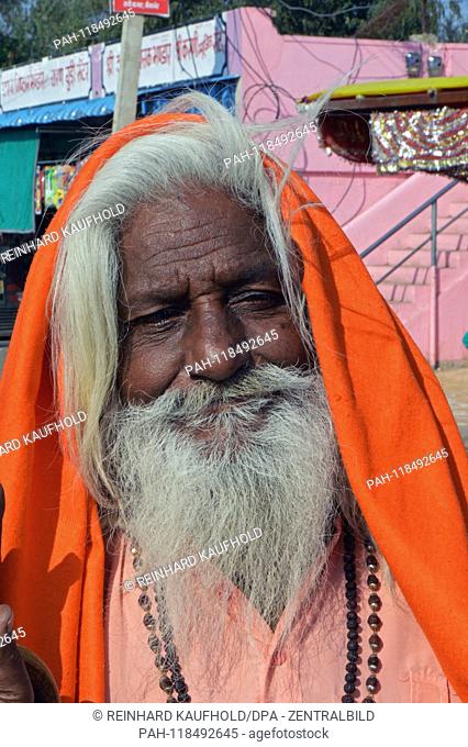 Pilgrim with an orange headgear at the Hindu Rattan Temple (Karni Mata Temple) in North India, added on 04.02.2019 | usage worldwide
