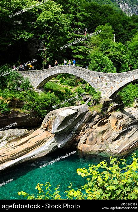 Old stone bridge over verzasca valley river in Ticino