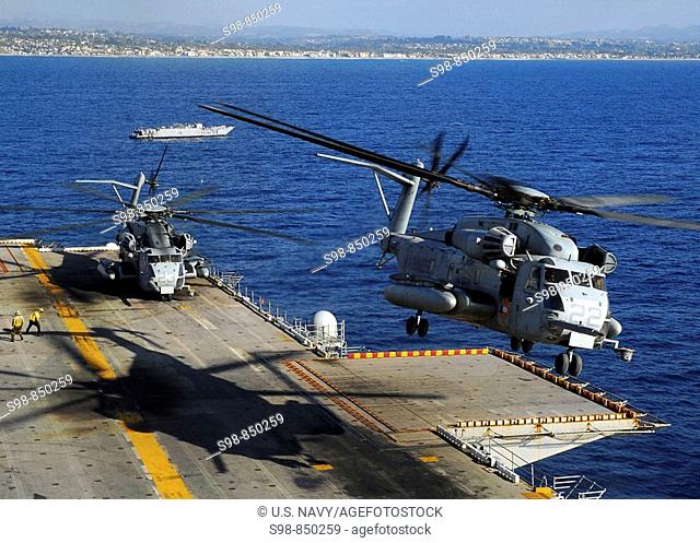 PACIFIC OCEAN (Nov. 3, 2008) A CH-53E Super Stallion helicopter descends to the flight deck during operations to disembark Marines after a scheduled six-month...