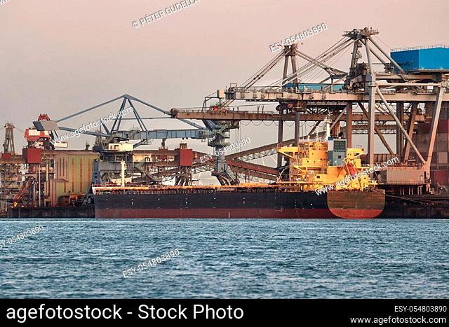 Cargo ship in an industrial dock, bulk terminal in Rotterdam