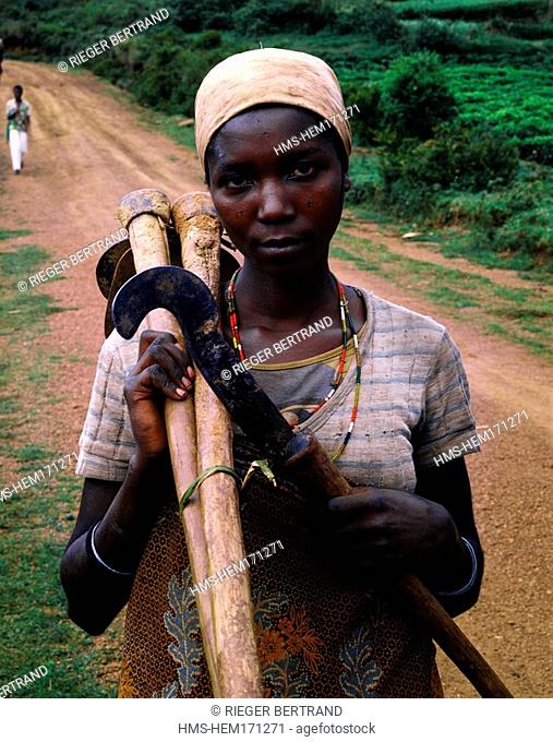 Burundi, Bujumbura Province, surroundings of Ijenda, Hutu woman coming back from fields, her face scarifications show she is Hutu