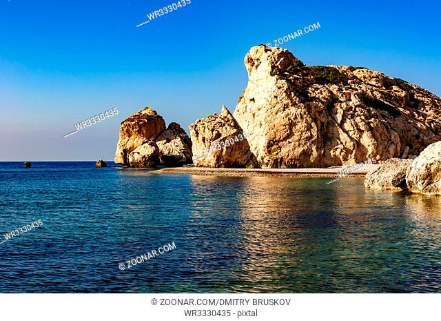 large rocky rock cliff in the Mediterranean sea against the blue sky