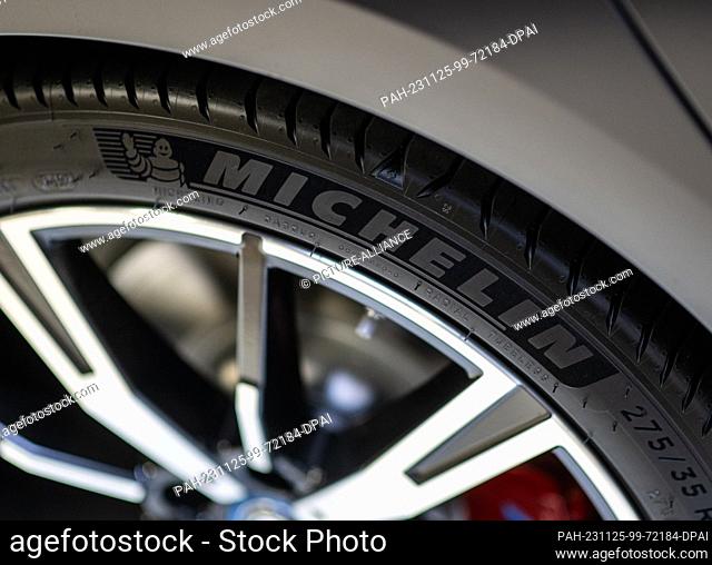 24 November 2023, Saxony, Dresden: A BMW with Michelin tires is parked at the branch in Dresden. Photo: Robert Michael/dpa. - Dresden/Saxony/Germany