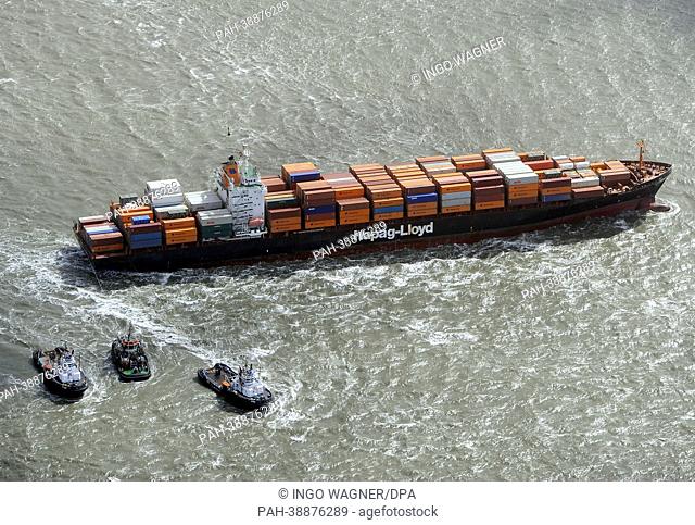 The container ship 'Norfolk Express' from shipping line Hapag Lloyd is stuck on a training wall on the outer Weser River near Bremerhaven,  Germany