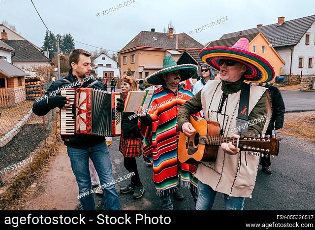 PUKLICE, CZECH REPUBLIC - MARCH 2, 2019: People attend the Slavic Carnival Masopust, a traditional ceremonial door-to-door procession in small village