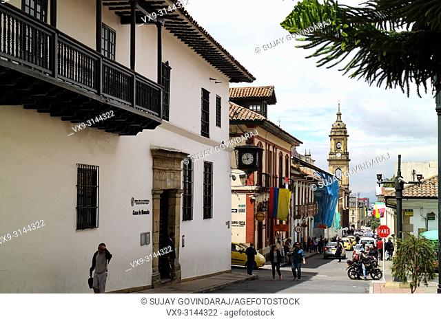 Bogota, Colombia - January 27, 2017: Looking down Calle, or translated into English, Street, 11 in La Candelaria. To the left of the image is the entrance to...