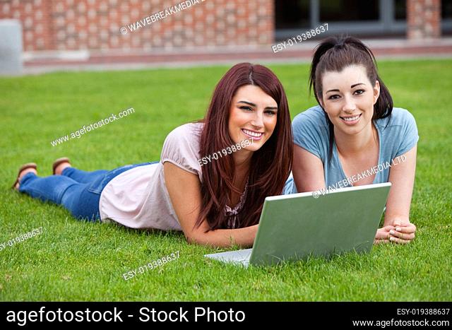 Friends using a notebook
