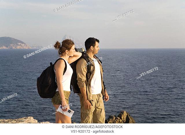 Hiking couple looking at the horizon