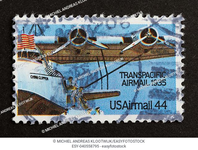 USA - CIRCA 1975: Stamp printed in the USA shows a airplane from the Transpacidic Airmail 1935, circa 1975