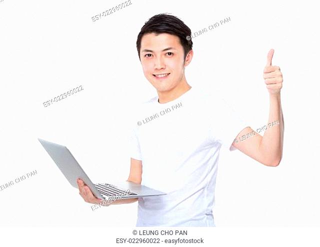 Aisan man with laptop and thumb up