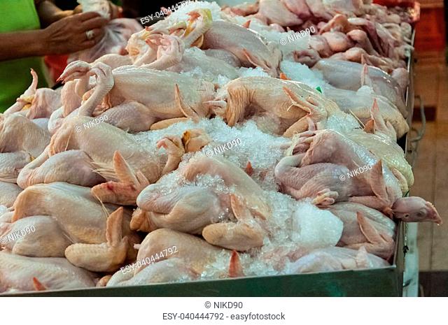 Dead and skinned chicken kept in ice for sale