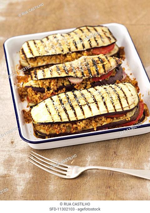 Grilled, gratinated aubergines with bulgur and tomatoes
