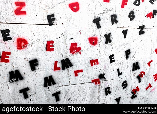 Letters of the alphabet painted on a wall. Ideal for creative concepts and backgrounds