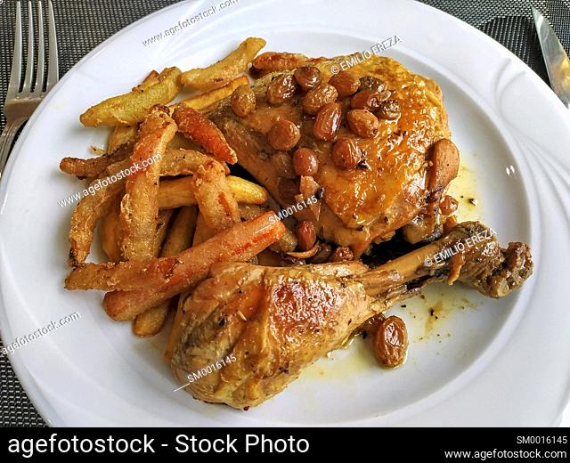 Chicken legs with pansies and vegetables