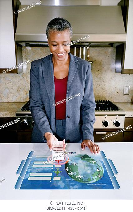 Businesswoman using computer in table