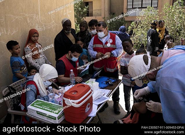 04 May 2023, Egypt, 6th of October City: A picture made available on 8 May 2023 shows People registering before receiving the coronavirus vaccine during a...