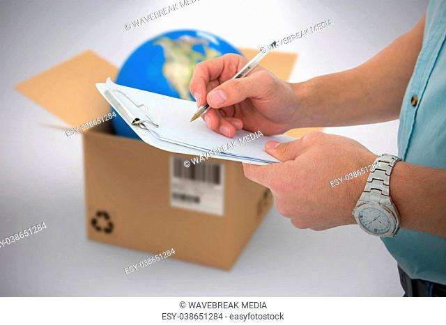 Composite 3d image of delivery man writing on clipboard